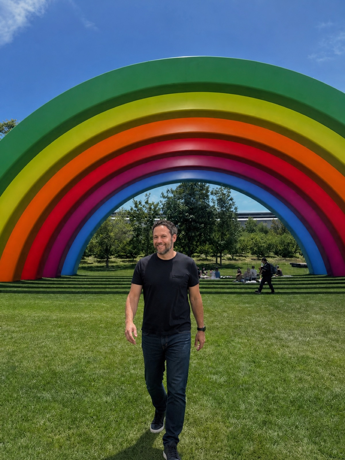 Jesse Kulp beneath the Apple Park rainbow
